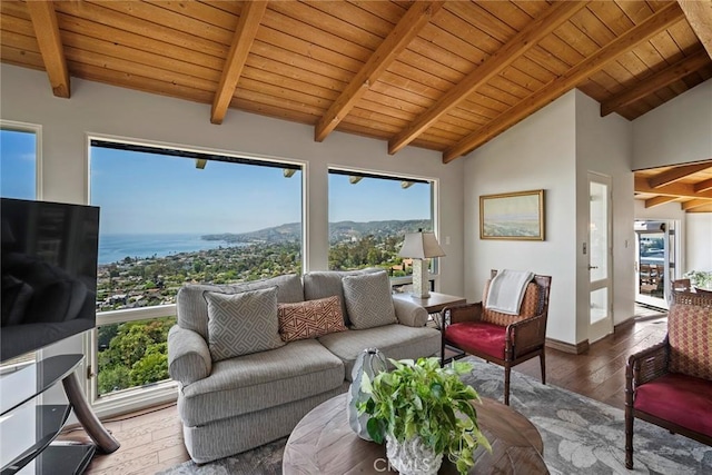 sunroom with vaulted ceiling with beams and wood ceiling