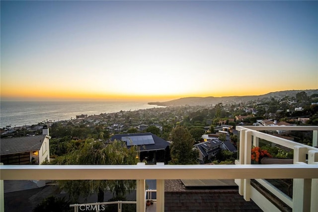 balcony at dusk with a water view