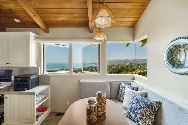 interior space featuring a mountain view, wood ceiling, and vaulted ceiling with beams