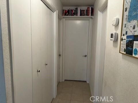 hallway featuring light tile patterned floors