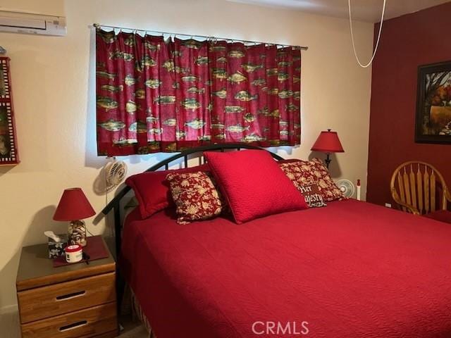 bedroom with a wall mounted air conditioner