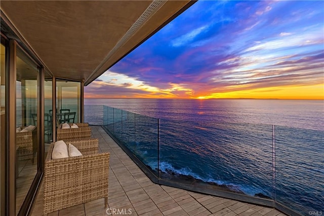 balcony at dusk with a water view