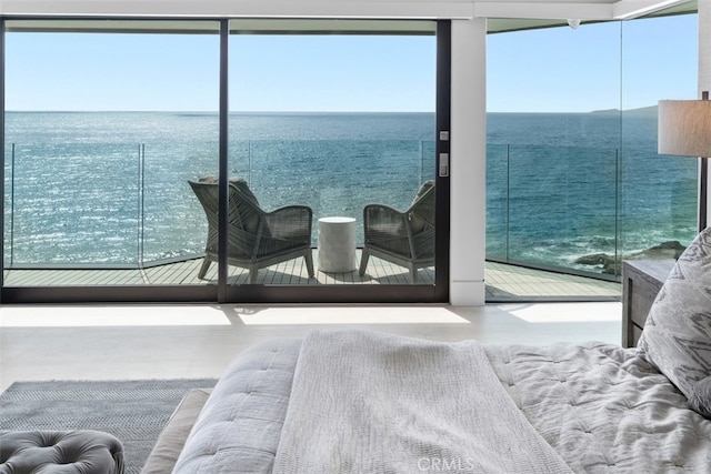 bedroom featuring a water view