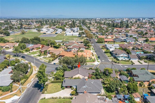 birds eye view of property with a residential view