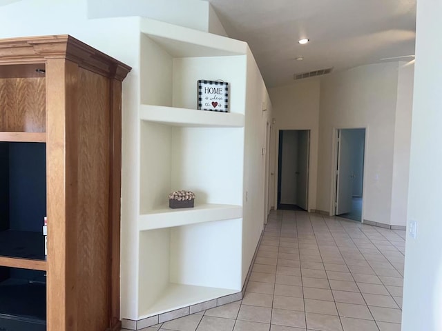 hallway with light tile patterned floors