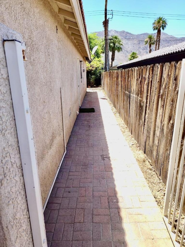 view of property exterior featuring a mountain view