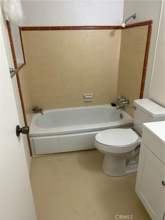 bathroom with shower / washtub combination, vanity, and toilet