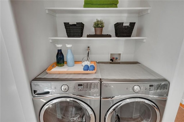 washroom with washer and dryer