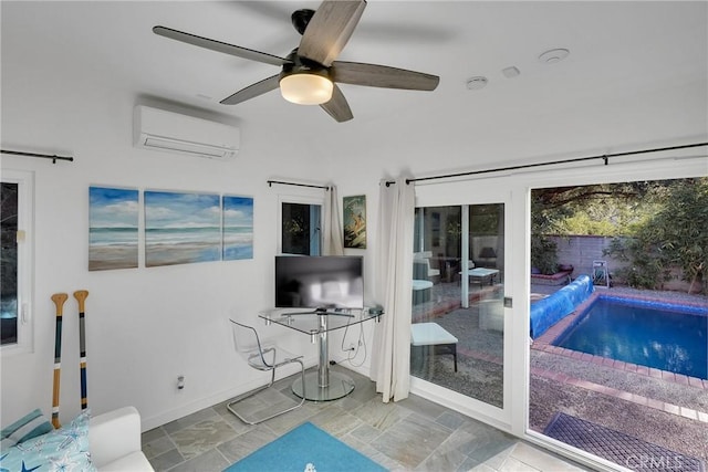 living room featuring a wall mounted air conditioner and ceiling fan