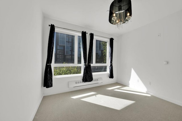 carpeted empty room with an inviting chandelier and plenty of natural light