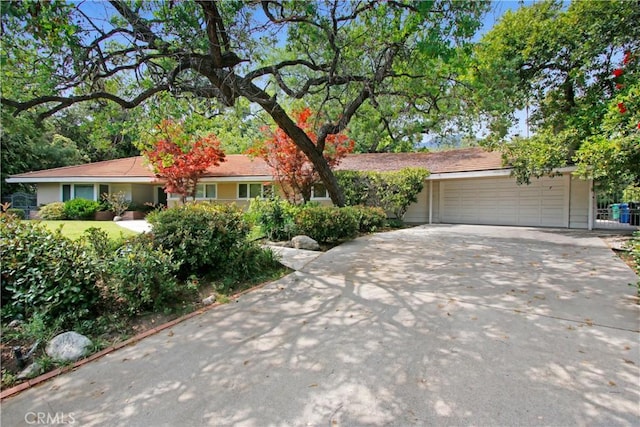 ranch-style home featuring a garage