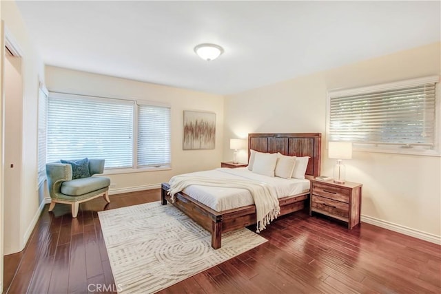 bedroom featuring dark hardwood / wood-style flooring