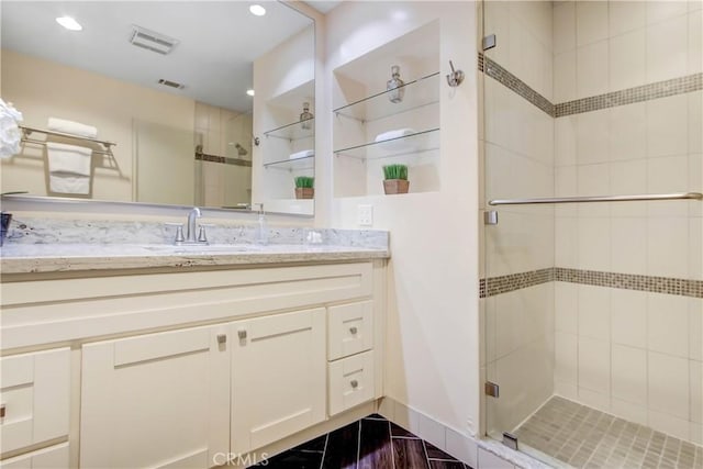 bathroom featuring vanity and walk in shower