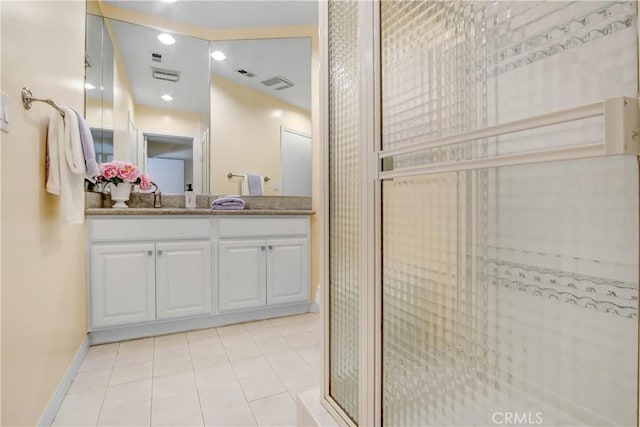 bathroom with tile patterned floors, vanity, and an enclosed shower