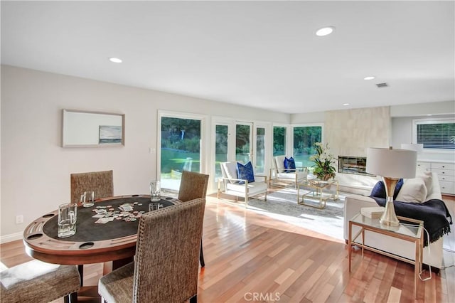 interior space featuring a large fireplace and hardwood / wood-style floors