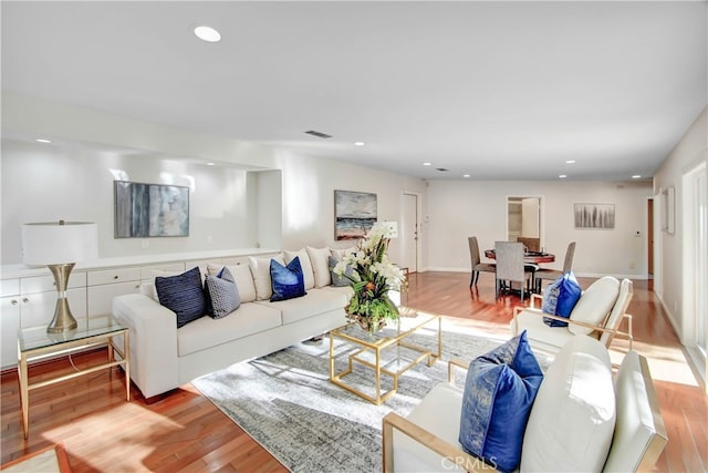 living room with light hardwood / wood-style flooring