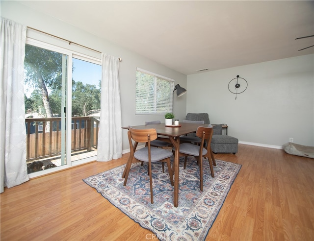 dining space featuring hardwood / wood-style flooring