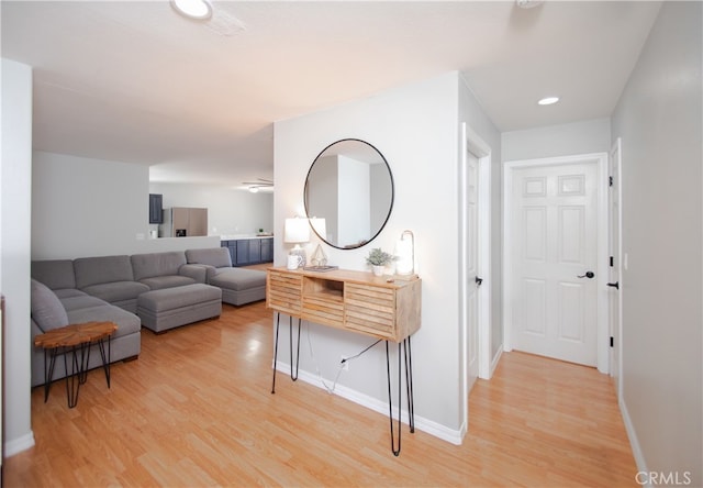 corridor with hardwood / wood-style flooring