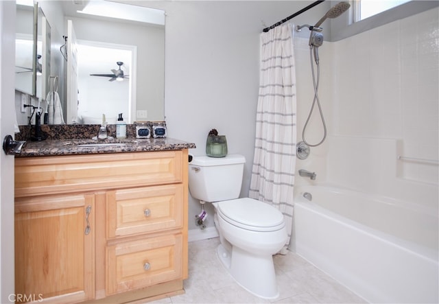 full bathroom with tile patterned floors, shower / bath combo with shower curtain, ceiling fan, vanity, and toilet