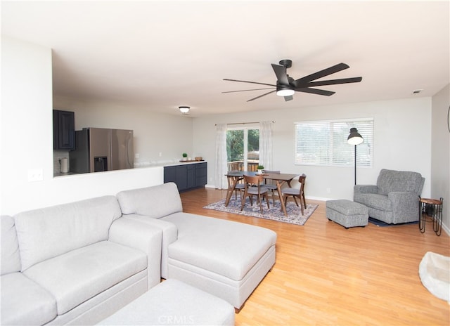 living room with hardwood / wood-style floors and ceiling fan