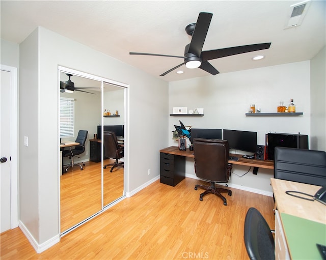 office space featuring ceiling fan and light wood-type flooring