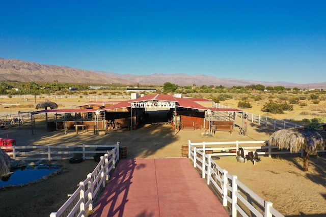 dock area with a mountain view and a rural view