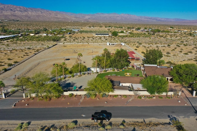 birds eye view of property with a mountain view and a rural view