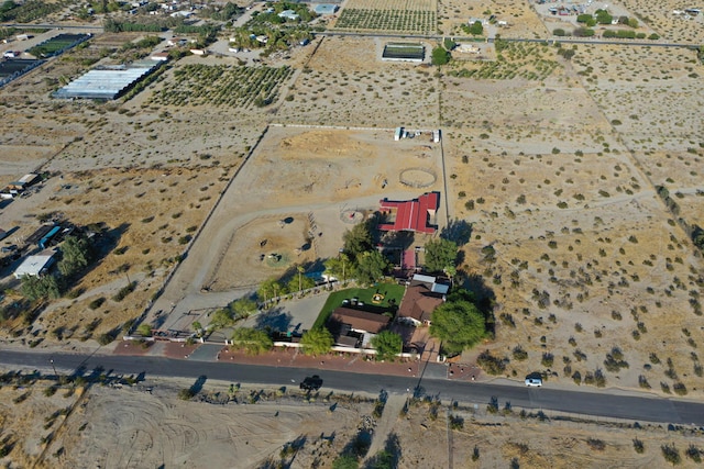 birds eye view of property with a rural view