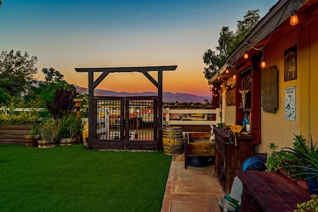 yard at dusk with a mountain view