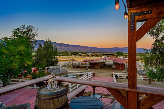 deck at dusk with a mountain view