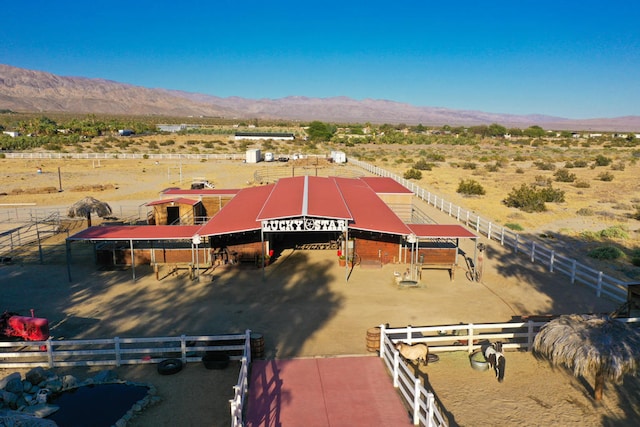 drone / aerial view with a mountain view and a rural view