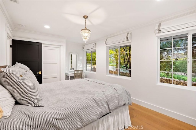 bedroom with recessed lighting, baseboards, ornamental molding, and light wood-type flooring