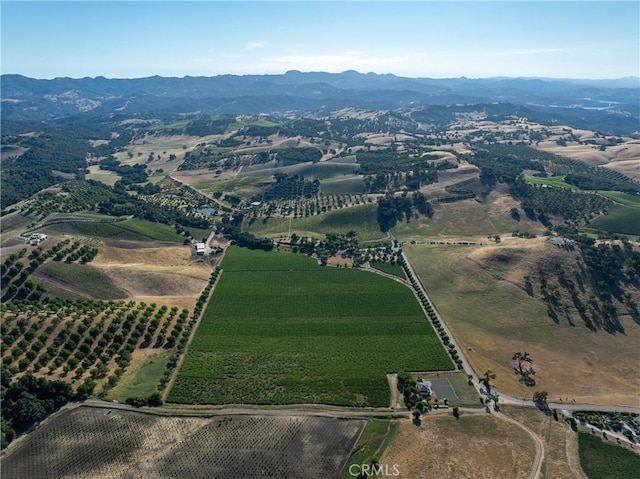 birds eye view of property with a mountain view and a rural view