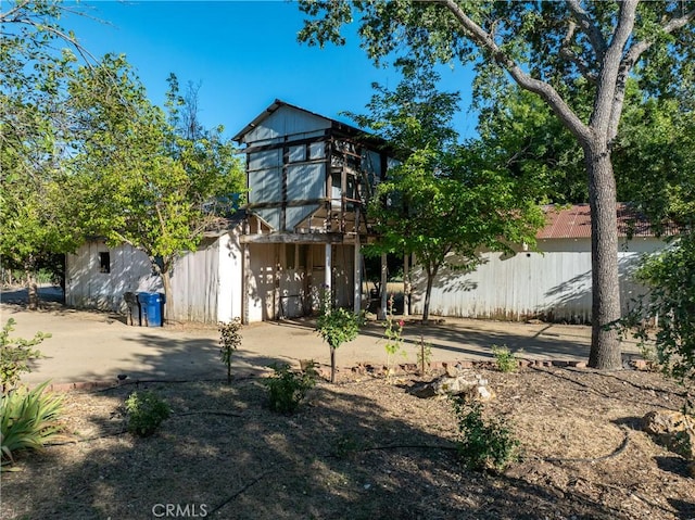 rear view of house with fence