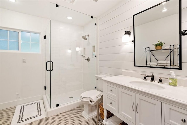 full bath with tile patterned flooring, a stall shower, vanity, toilet, and recessed lighting