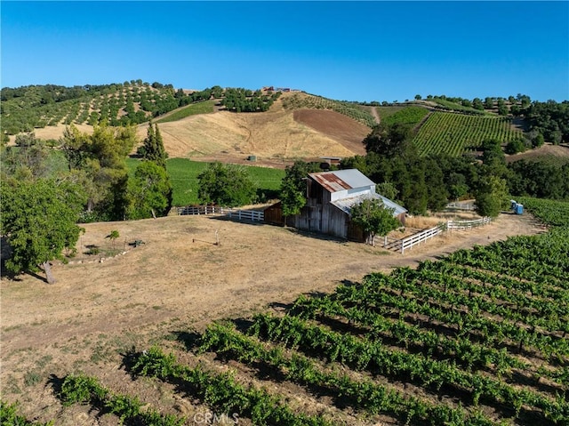 birds eye view of property with a rural view