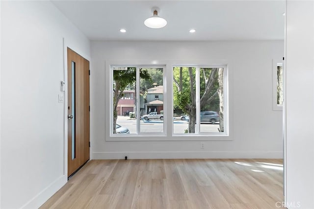 unfurnished room featuring light hardwood / wood-style floors