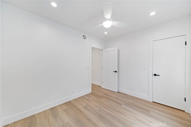 unfurnished bedroom featuring light hardwood / wood-style floors and ceiling fan