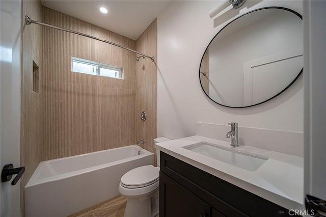 full bathroom featuring vanity,  shower combination, and toilet