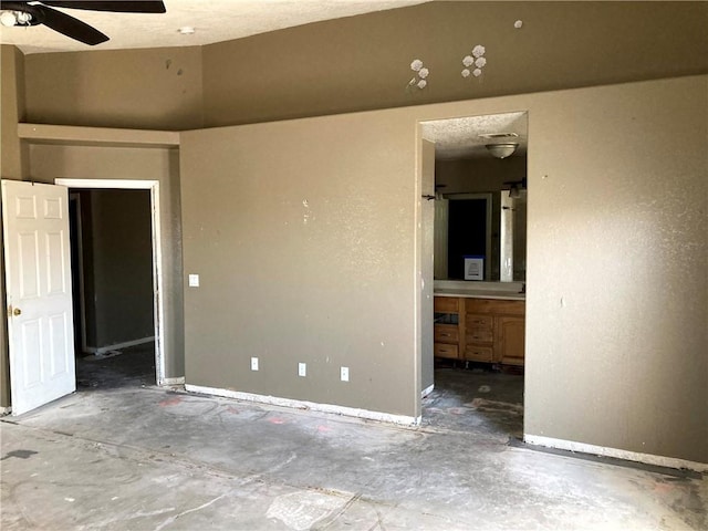 unfurnished room featuring a textured ceiling, concrete floors, and ceiling fan