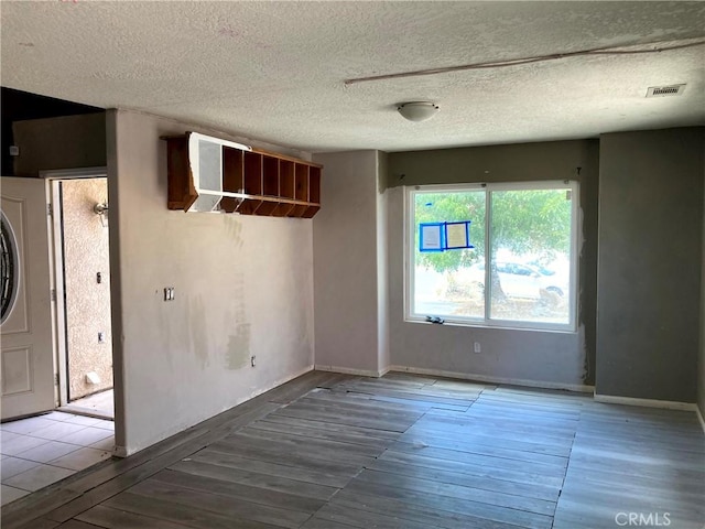 empty room featuring a textured ceiling