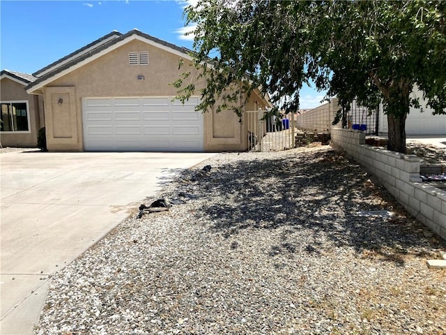 view of property exterior featuring a garage