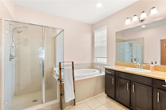 bathroom with tile patterned floors, vanity, and plus walk in shower