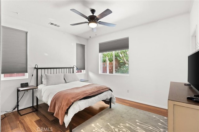 bedroom featuring wood-type flooring and ceiling fan