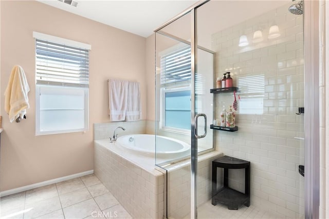 bathroom featuring tile patterned flooring and shower with separate bathtub