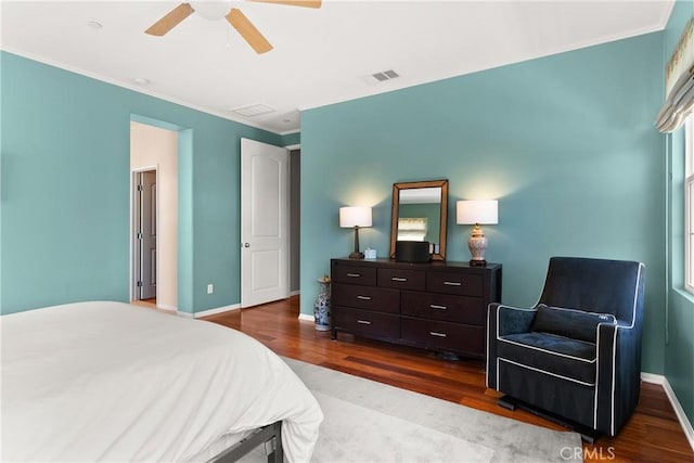 bedroom featuring ceiling fan, hardwood / wood-style floors, and ornamental molding