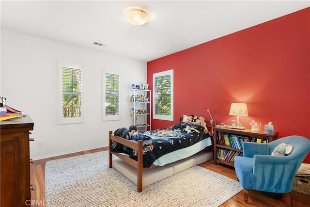 bedroom featuring hardwood / wood-style floors