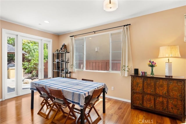 dining area with light hardwood / wood-style flooring