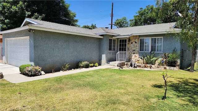 ranch-style home with a garage and a front lawn