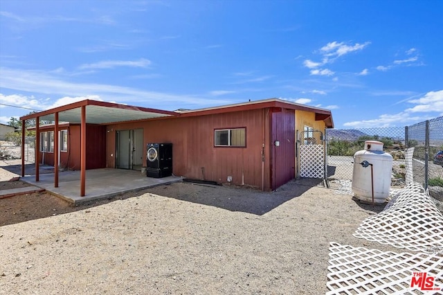 rear view of house featuring a patio area